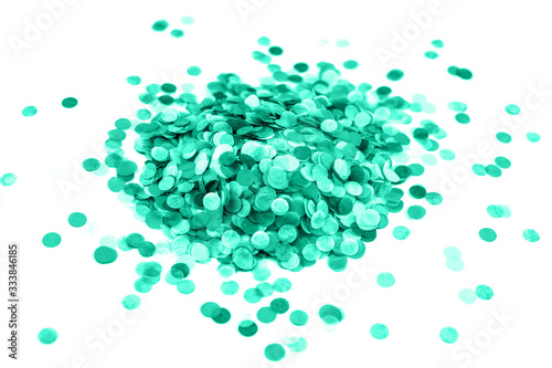Heap of mint confetti isolated on white.