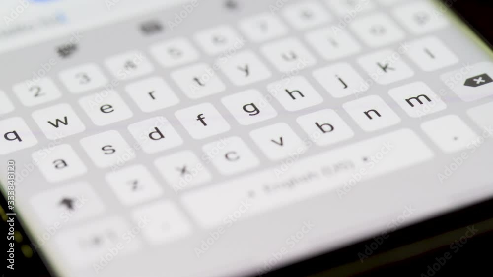 Close up shot: Digital screen of smart phone typing text message with smart pen for communication or work at home Close up shot: Digital screen of smart phone typing text message with smart pen for communication or work at home