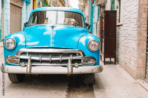 View of yellow classic vintage car in Old Havana, Cuba © travnikovstudio