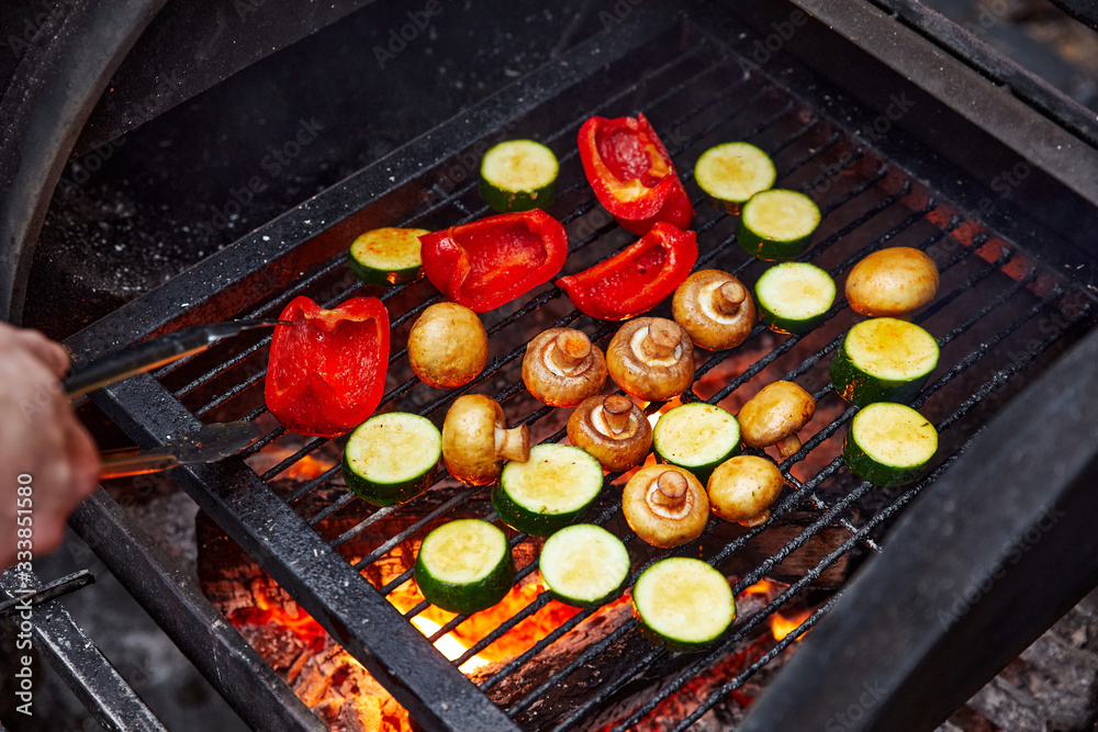 vegetables and mushrooms that are grilled on a charcoal grill, eggplant, mushrooms and pepper vegetables and mushrooms that are grilled on a charcoal grill, eggplant, mushrooms and pepper