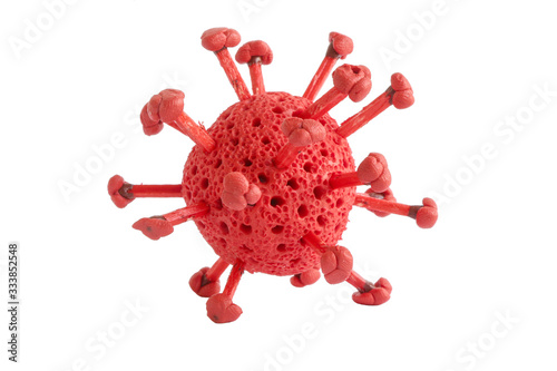 Red handmade model of coronavirus or the other virus isolated on the white background. Model virus made from plasticine and matches. Theme of health care, medical treatment and disease prevention. photo