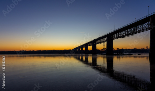 Sunrise near a river and a bridge in Portugal