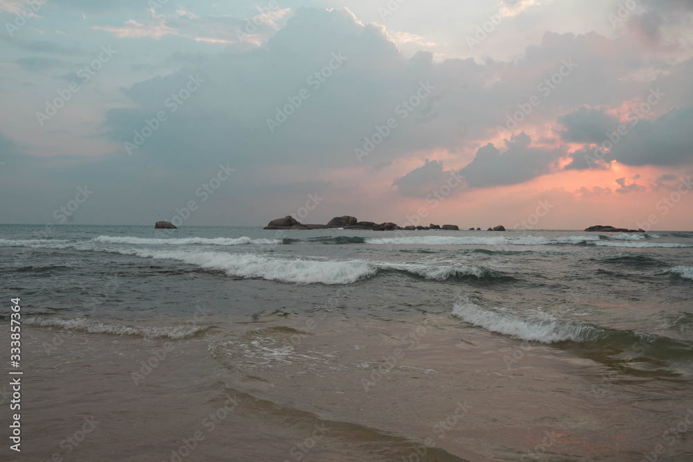 indian ocean at sunset in sri lanka