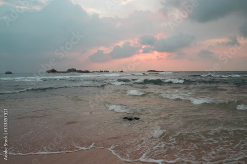 indian ocean at sunset in sri lanka photo