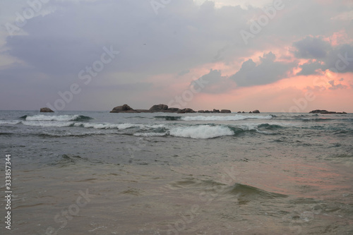 indian ocean at sunset in sri lanka