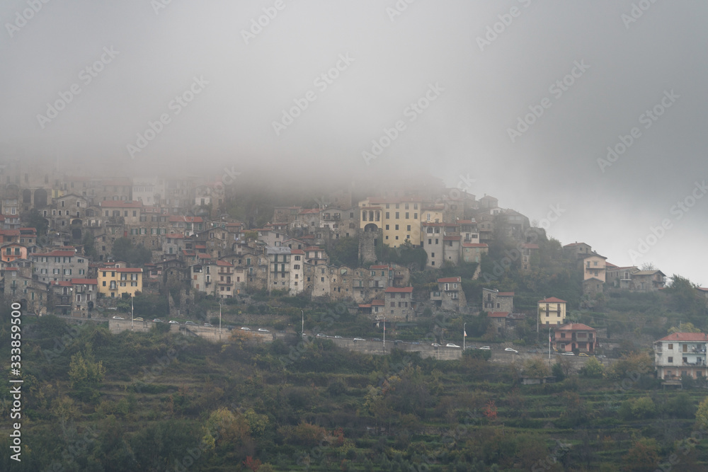 Italy. Triora ancient village covered in dense fog