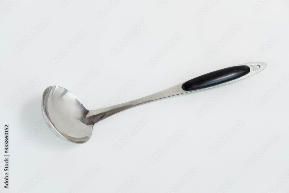 Metal Soup Spoon with black plastic handle isolated on white background Metal Soup Spoon with black plastic handle isolated on white background