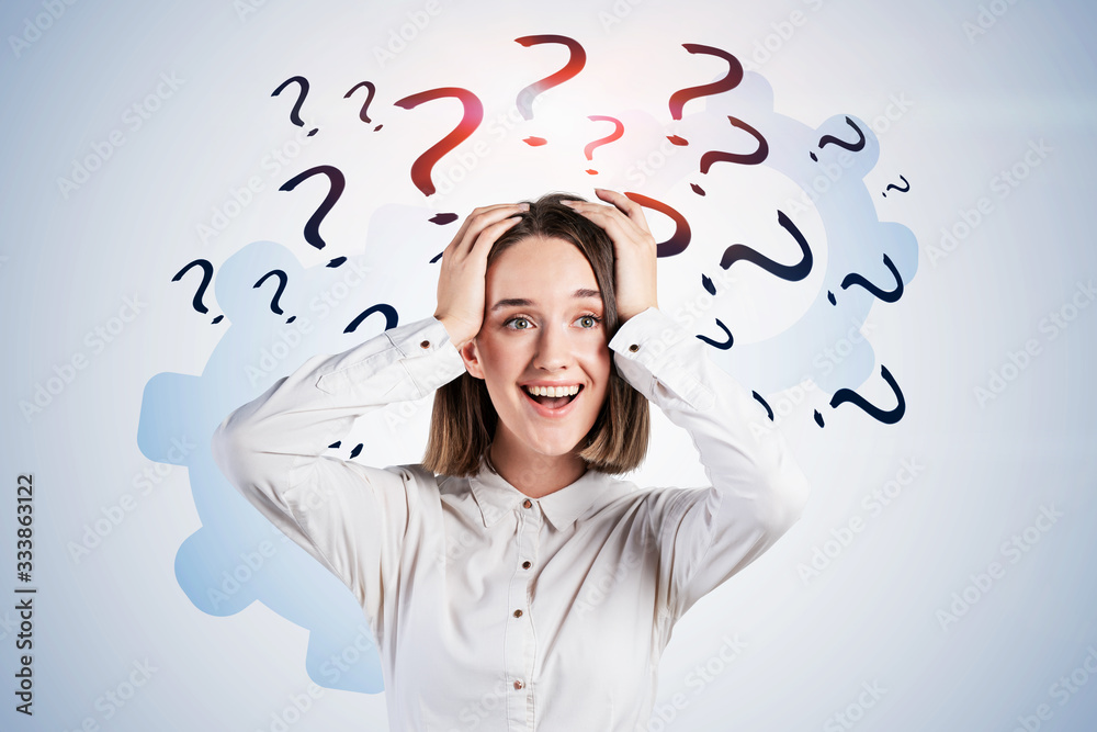 Shocked young woman, question marks and gears Shocked young woman, question marks and gears