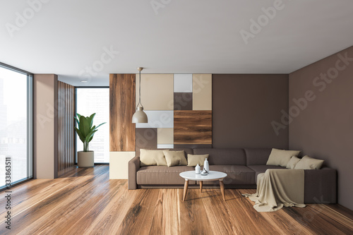 Gray living room interior with brown sofa