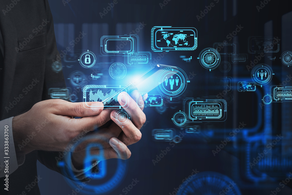 Fototapeta premium Man hands with smartphone in office, HUD interface