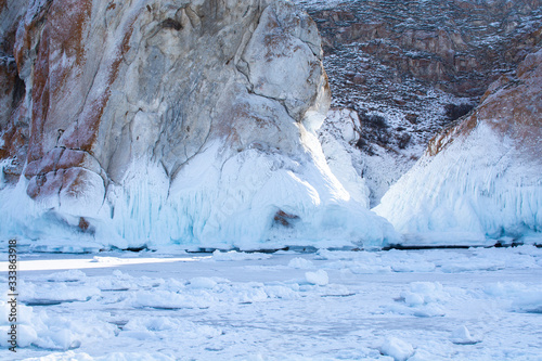 Rock cliff with ice stalactite in Lake Baikal, Russia, landscape photography