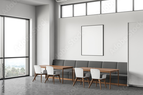 Gray sofa in modern cafe corner with poster