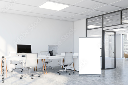 White open space office with poster