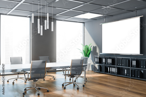 Grey conference room interior with poster