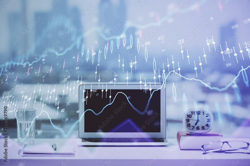 Forex Chart hologram on table with computer background. Double exposure. Concept of financial markets. Forex Chart hologram on table with computer background. Double exposure. Concept of financial markets.