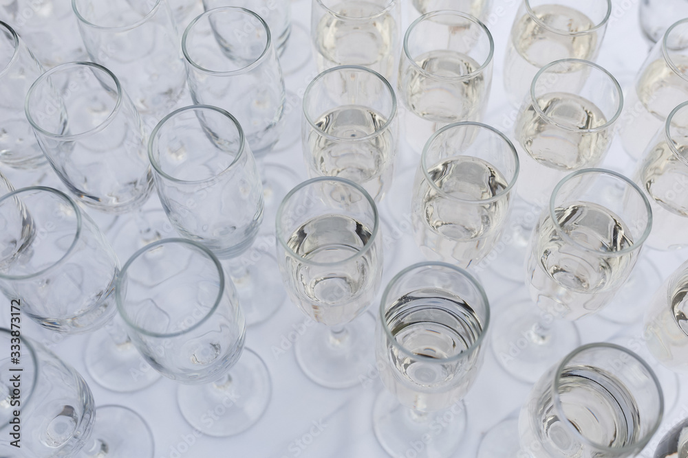 Glasses of champagne and sparkling wine served at charity event Glasses of champagne and sparkling wine served at charity event