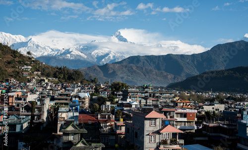 The cityscape of Pokhara with the Annapurna mountain range covered in snow at Nepal Asia © Michalis Palis