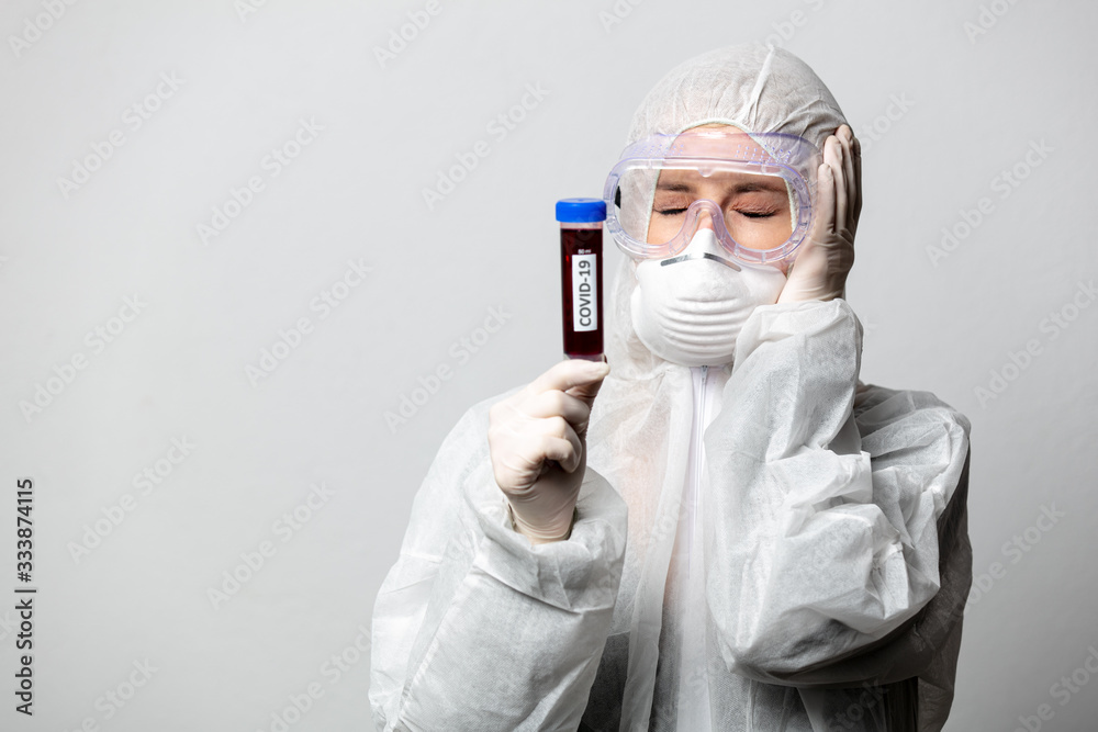 Doctor in protection clothes holds COVID-19 vaccine Doctor in protection clothes holds COVID-19 vaccine