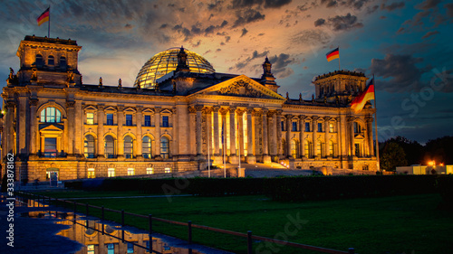 The famous Reichstag building, seat of the German Parliament (Deutscher Bundestag) at sunset in Berlin, Germany photo