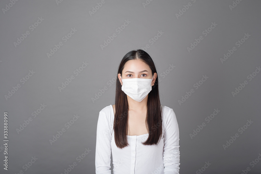 Portrait of woman with surgical mask in studio, Health care concept Portrait of woman with surgical mask in studio, Health care concept