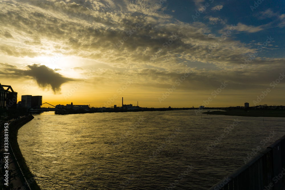 Sunset with clouds and industrial scenery