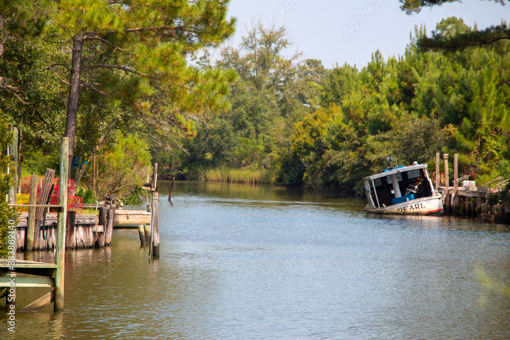 Plash island bon secour river and creeks with trees and half sunken boat Plash island bon secour river and creeks with trees and half sunken boat