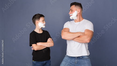 Photos Dad and son with shaving foam on faces looking at each other