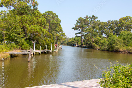 Plash island bon secour river and creeks with trees and half sunken boat
