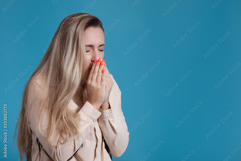 Woman sneezes. Coronavirus. Covid-19. 2019-ncov. Woman sneezes. Coronavirus. Covid-19. 2019-ncov.