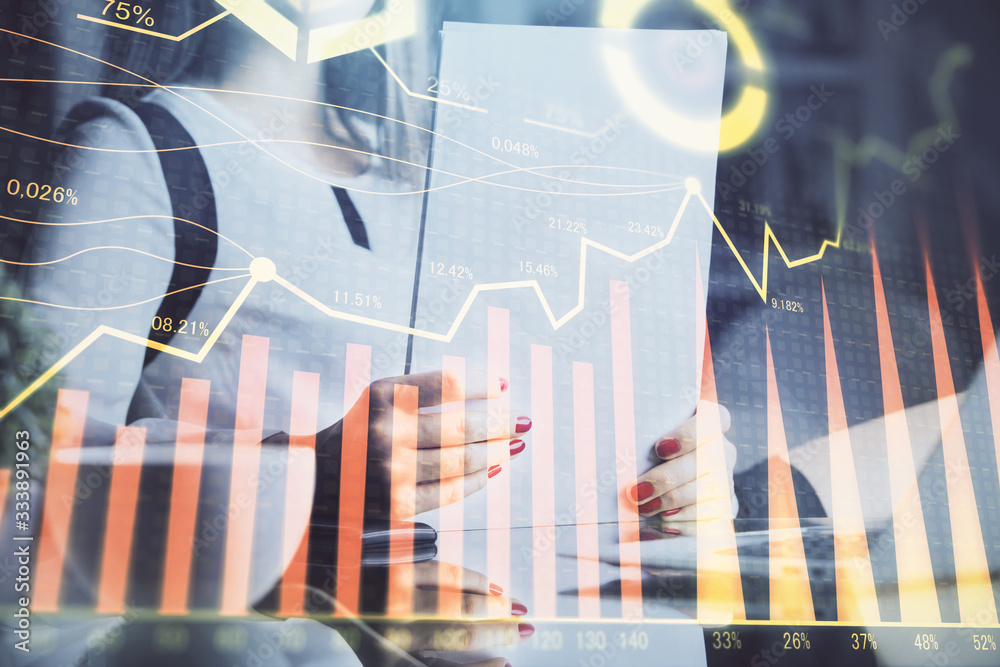 Double exposure of hands making notes with forex chart huds. Stock market concept. Double exposure of hands making notes with forex chart huds. Stock market concept.