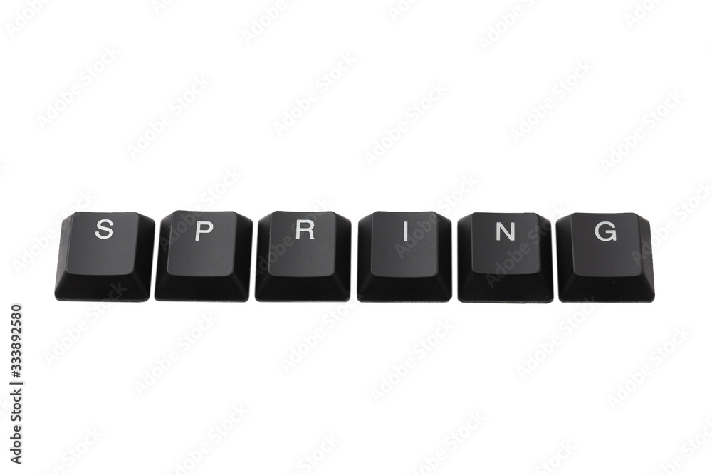 Word spring written on keyboard. Isolated on white. Word spring written on keyboard. Isolated on white.