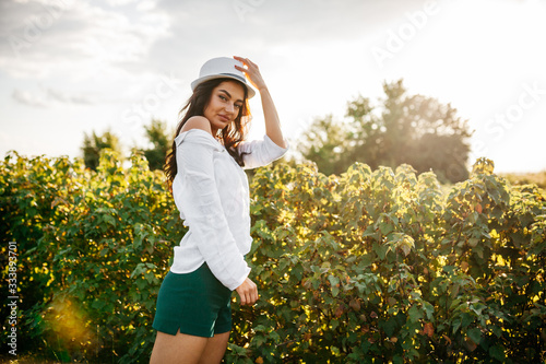 Beauty Romantic Girl Outdoors. Beautiful Teenage Model girl in Casual Short Dress on the Field in Sun Light. Autumn.