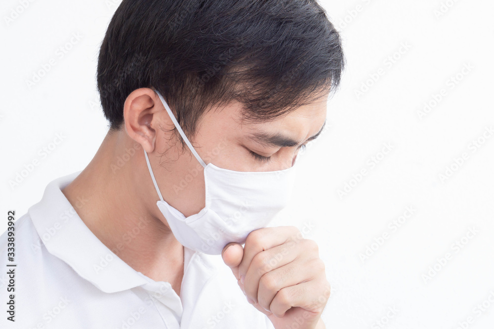 Closeup man wearing face mask for protect air polution or virus covid 19 with cough on white background, health care and medical concept Closeup man wearing face mask for protect air polution or virus covid 19 with cough on white background, health care and medical concept