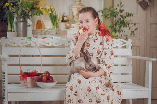 little girl with rabbit  in the kitchen