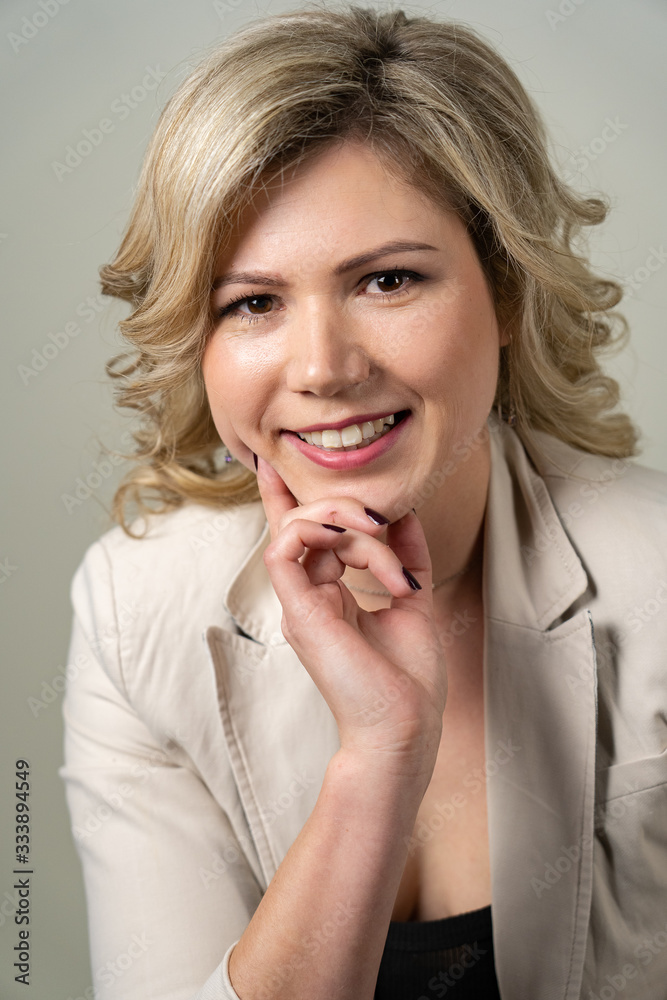 woman 30 years old with blond hair posing on a white background