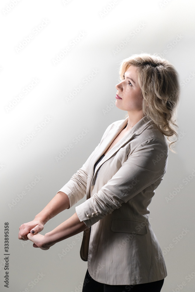 30 years old woman with blond hair in business clothes posing
