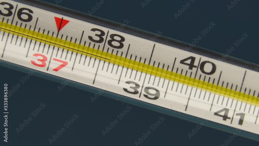 close-up thermometer, mercury, shows a temperature of 38 degrees. Indicates fever and high fever. close-up thermometer, mercury, shows a temperature of 38 degrees. Indicates fever and high fever.