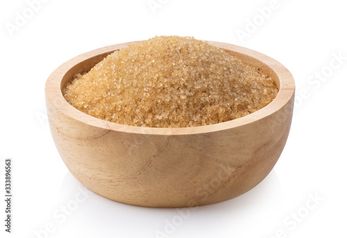 brown sugar in wood bowl isolated on white background