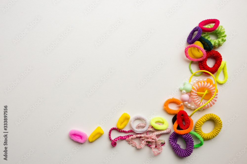 Multi-colored rubber bands on a white background