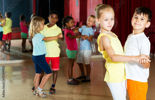 Children trying partner dance in class