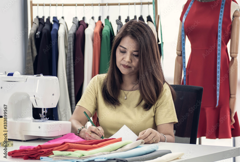 A fashion designer is sketching A fashion designer is sketching