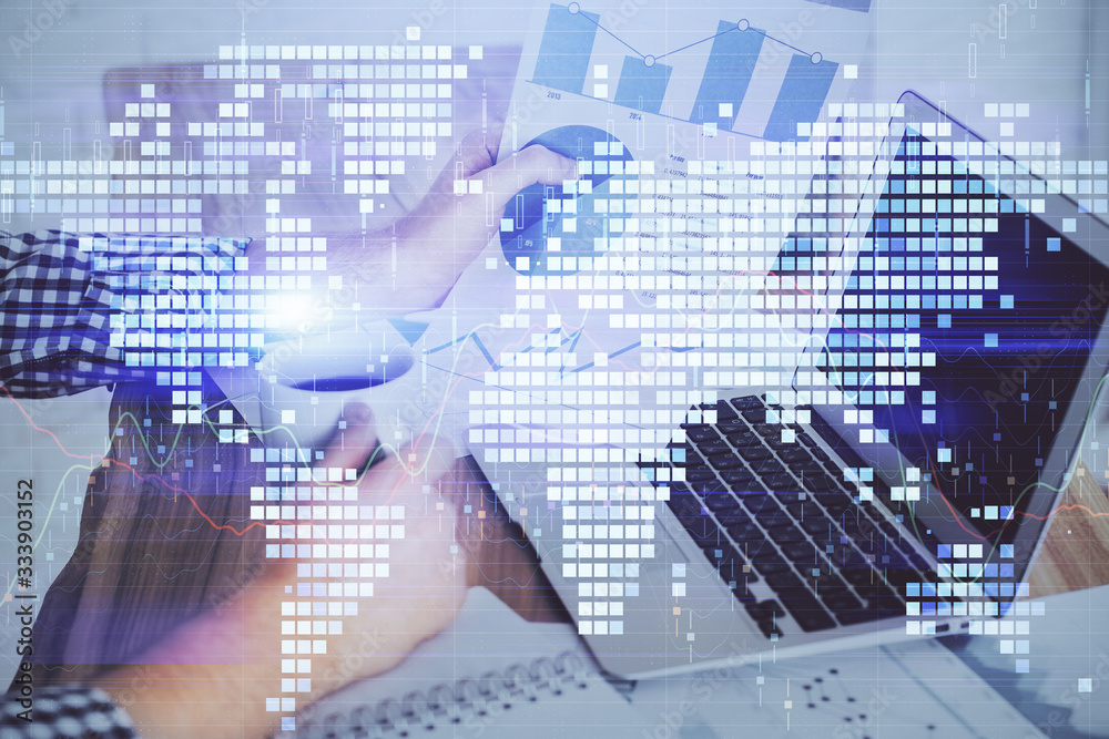 Double exposure of businessman working on laptop on background. International business hologram in front. Concept of success. Double exposure of businessman working on laptop on background. International business hologram in front. Concept of success.
