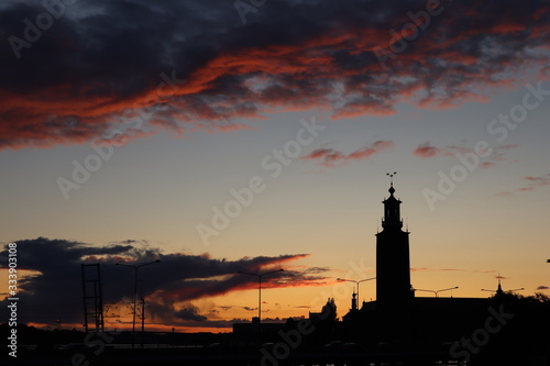 solo travel | city landscape | stockholm, sweden | sunset with orange sky and cloud