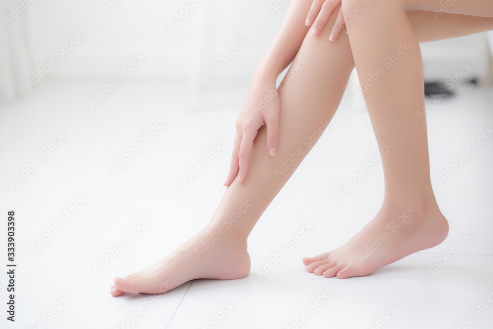 Beautiful asian woman touch skin leg smooth with cream and lotion for hydration and smooth, girl applying body care and cosmetic for silky and soft, beauty perfect with wellness, health and care. Beautiful asian woman touch skin leg smooth with cream and lotion for hydration and smooth, girl applying body care and cosmetic for silky and soft, beauty perfect with wellness, health and care.