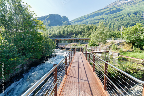 GEIRANGER, NORWAY - 2016 JUNE 14. Walking on the platform by the Storfossen waterfall at Geiranger heading to the Norwegian Fjord Centre (Norsk Fjordsenter) Museum