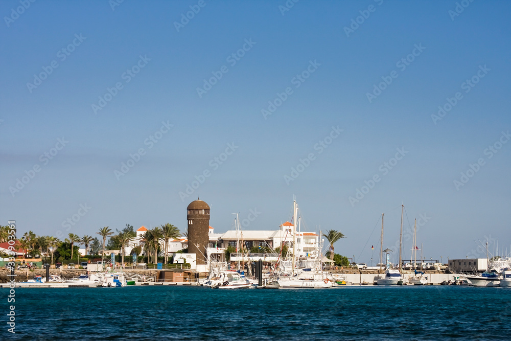 Marina with lighthouse in Caleta de Fuste, Fuerteventura, Canary Islands, Spain, Europe
