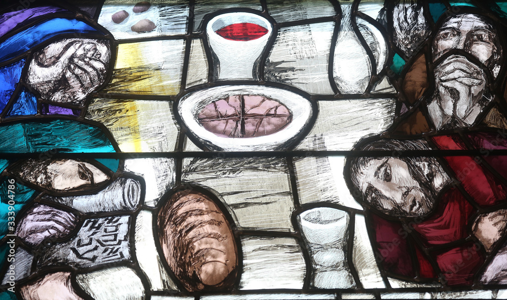 Fototapeta premium God begins salvation in this world through His Son Jesus Christ, detail of stained glass window by Sieger Koder in St. John church in Piflas, Germany