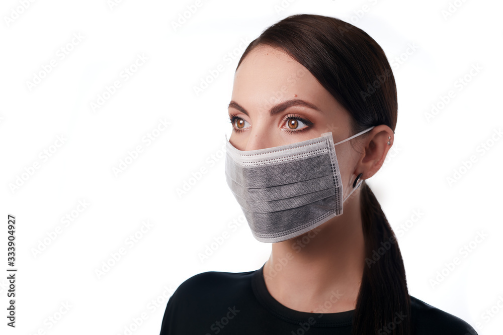 Young woman in medical mask on face, healthcare corona virus covid 19 pneumonia pandemic protective lifestyle concept. Patient health safety equipment hospital equipment uniform. Young woman in medical mask on face, healthcare corona virus covid 19 pneumonia pandemic protective lifestyle concept. Patient health safety equipment hospital equipment uniform.