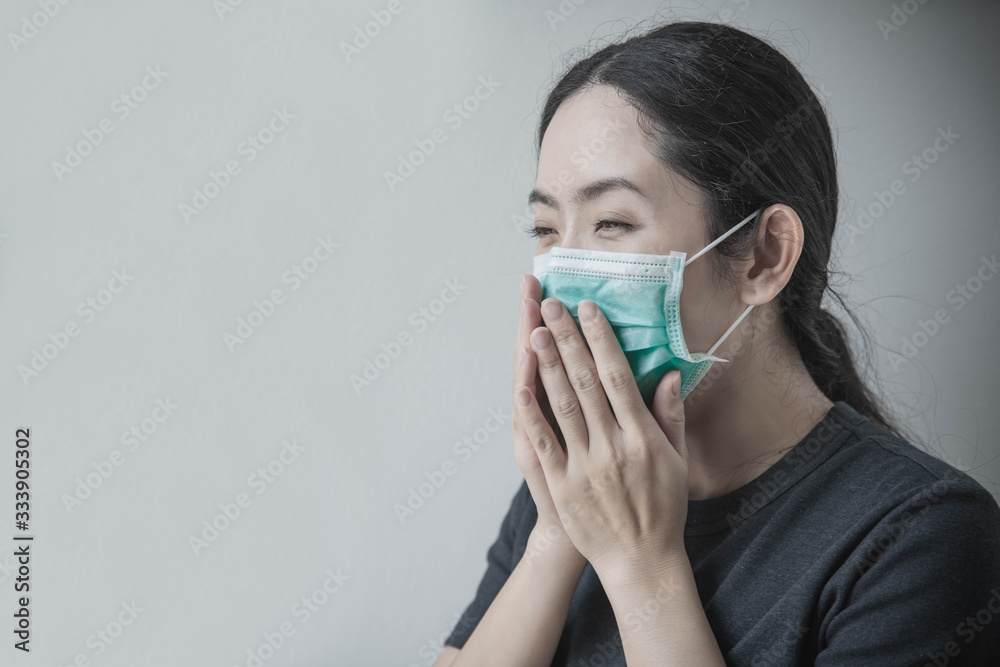 Asian woman wearing protection face mask against coronavirus. Woman wearing hygienic mask to prevent infection, airborne respiratory illness such as flu, 2019-nCoV. Asian woman wearing protection face mask against coronavirus. Woman wearing hygienic mask to prevent infection, airborne respiratory illness such as flu, 2019-nCoV.