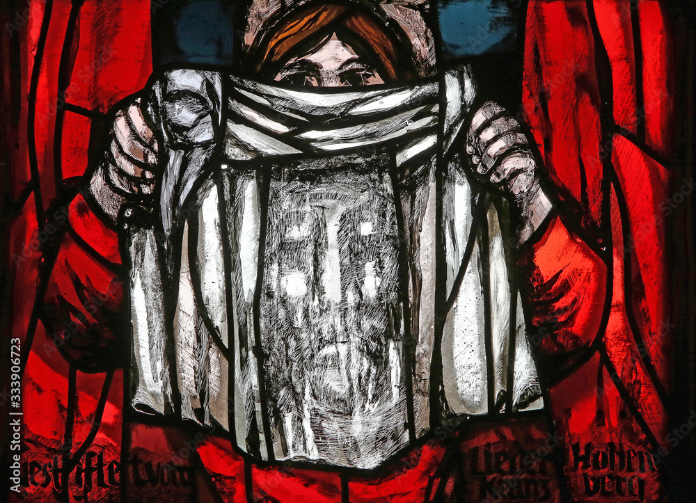 Veronica holding her veil, Dark sun of Good Friday, detail of stained glass window by Sieger Koder in St. James church in Hohenberg, Germany